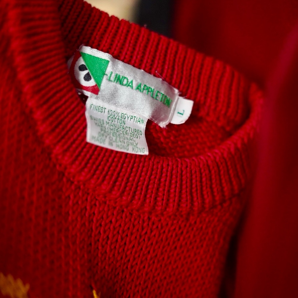 Vibrant Red Sweater with Yellow Lion Design